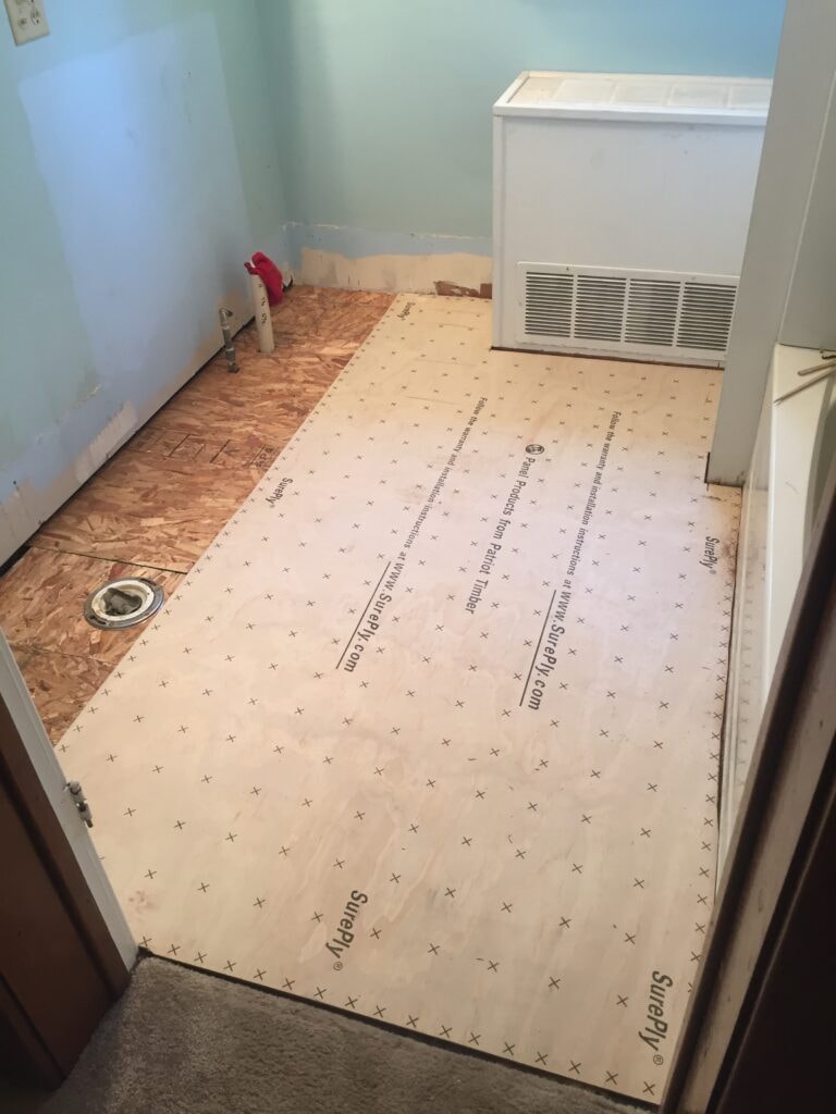 Bathroom remodel Findlay — during: new SurePly underlayment installed over subfloor, Findlay, Ohio