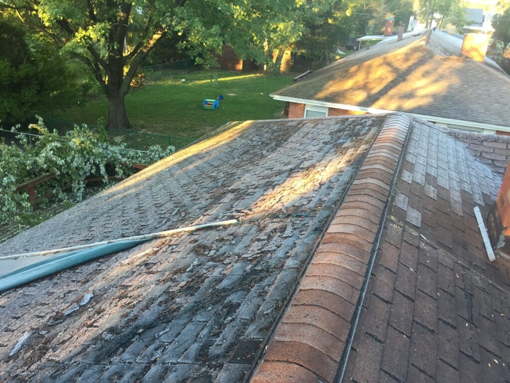 Complete home remodel Findlay — before: deteriorated shingles and damaged roofing surface, Findlay, Ohio
