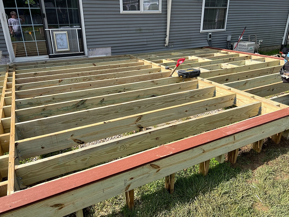 Composite deck — during construction: completed treated lumber joist framing viewed from above, ready for composite decking, Findlay, Ohio