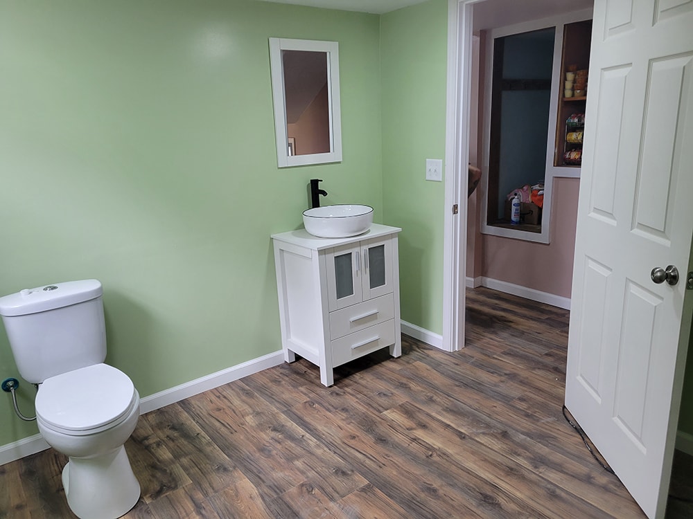 Entire house remodel — after: completed main floor interior with new flooring and open floor plan — Arlington, Ohio