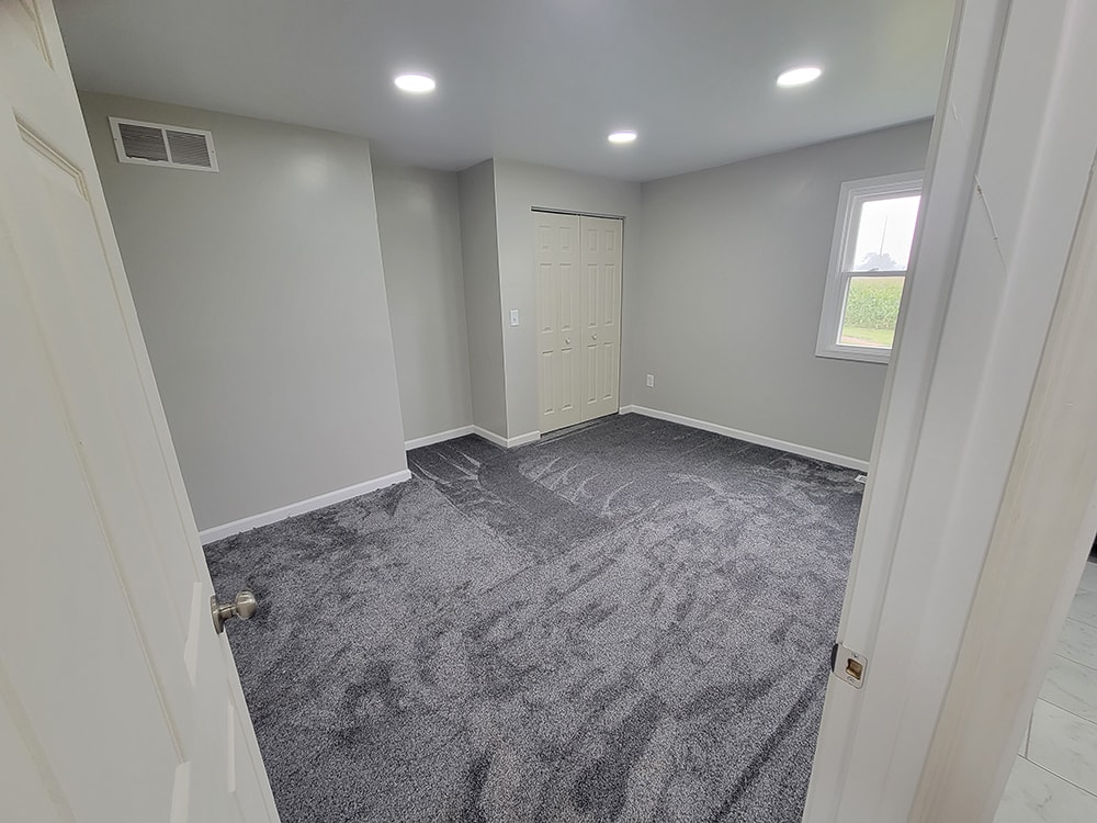 Entire house remodel — after: completed bathroom addition with walk-in shower and tile — Arlington, Ohio