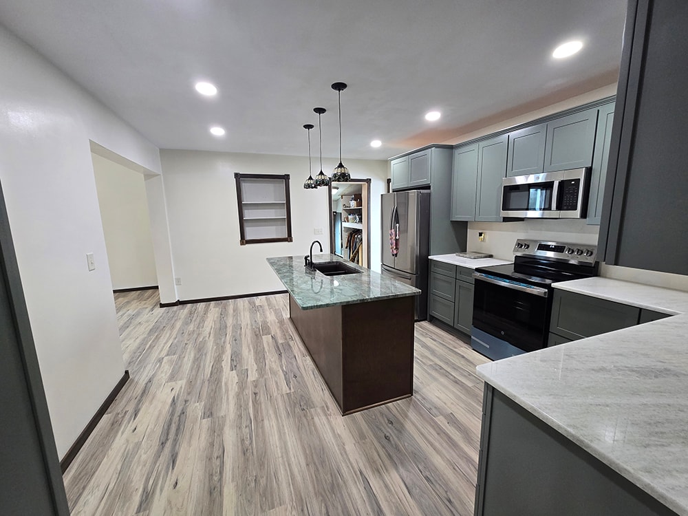 2 additions home remodel — completed kitchen wide view with open floor plan — Findlay, Ohio