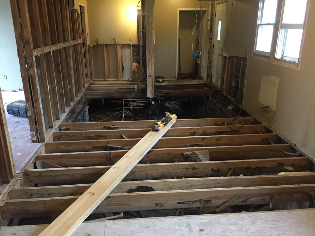 Kitchen family room remodel Arcadia — during: new floor joists installed throughout open-plan area, Arcadia, Ohio