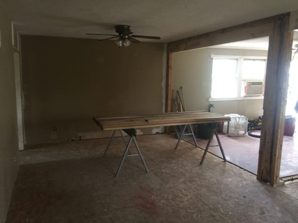 Kitchen family room remodel Arcadia — during: family room with new subfloor and open framing, Arcadia, Ohio