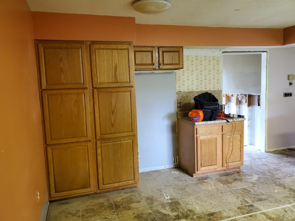 Kitchen remodel Findlay — before: original oak cabinets and pantry wall, Findlay, Ohio