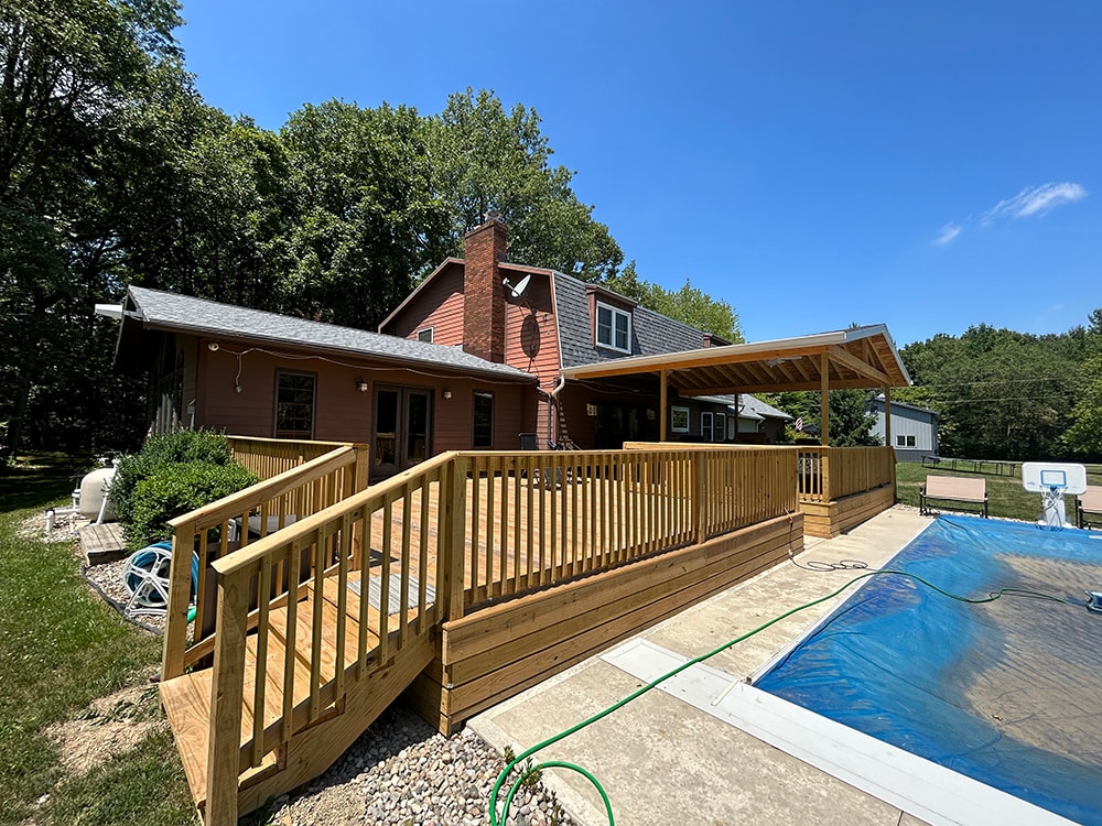 New treated deck with gable — poolside railing and stairs with full deck and gable view
