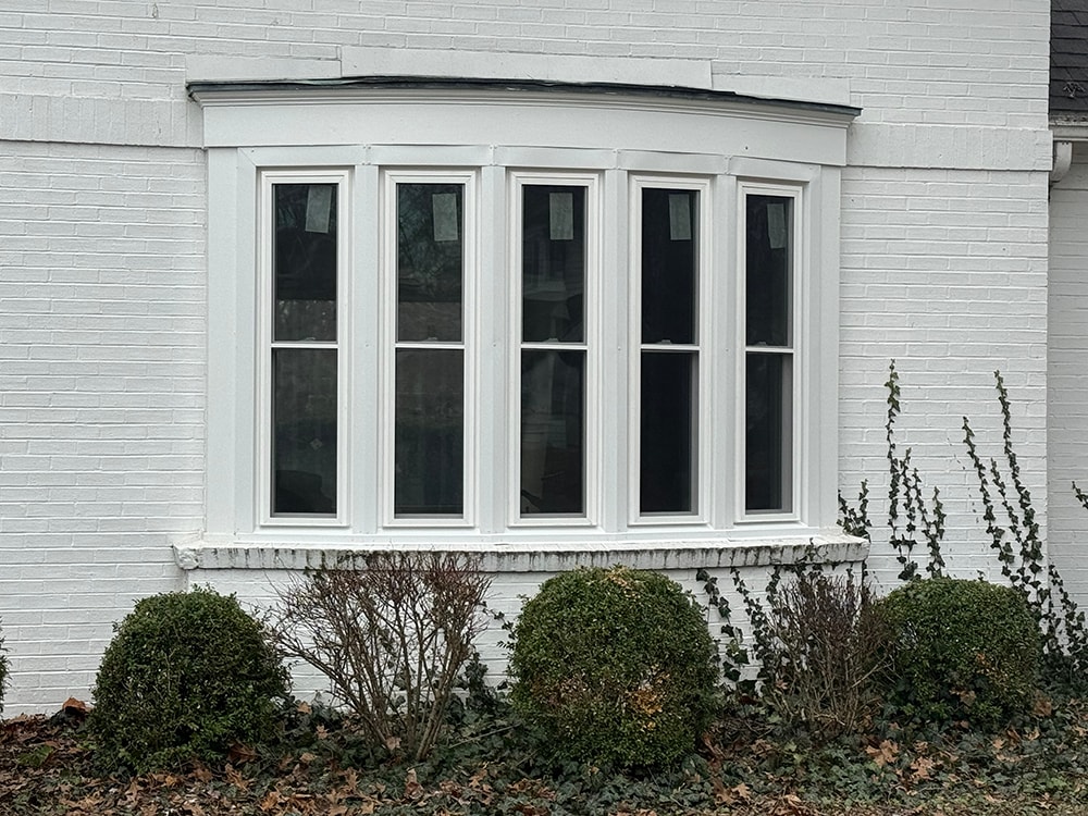 New bow window installation on white brick home — Findlay, Ohio