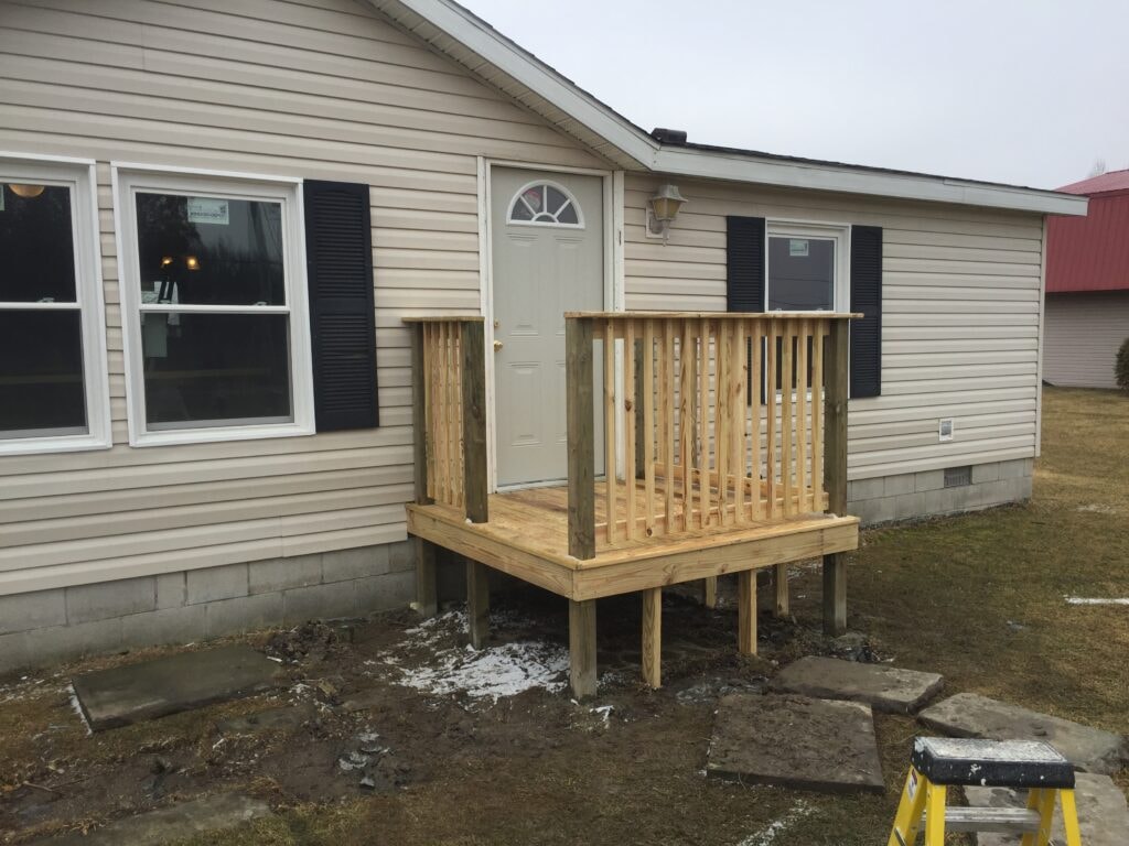 Completed front porch deck with railing and steps — Oak Harbor, Ohio