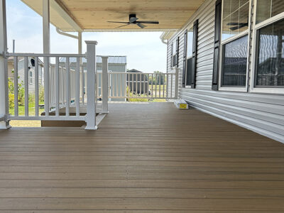 Decking with Cedar tongue and groove ceiling and white aluminum railings